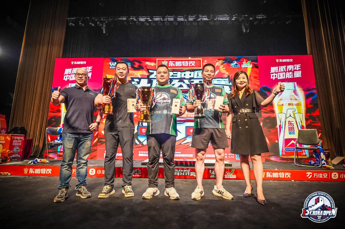 A group of people holding trophies